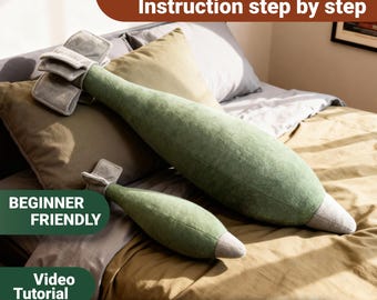 May include: Two plush pillows shaped like bombs in a soft green fabric with grey fin details at the base and a grey pointed tip. The image includes text stating PDF Pattern, Instruction step by step, BEGINNER FRIENDLY, Video Tutorial, and INSTANT DOWNLOAD.