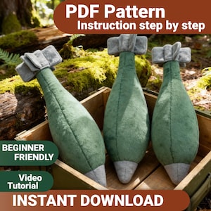 May include: Three plush toys shaped like bombs, featuring a green body, a grey pointed tip, and a grey fin assembly at the top. The text "PDF Pattern Instruction step by step", "BEGINNER FRIENDLY", "VIDEO TUTORIAL", and "INSTANT DOWNLOAD" is visible.