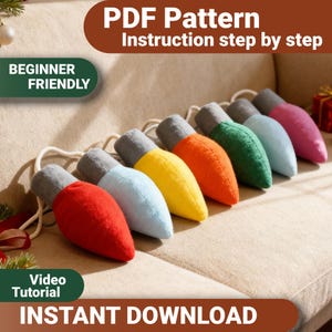 May include: A colorful string of plush Christmas light ornaments in red, blue, yellow, orange, green, light blue, and pink. Each light has a gray base and is connected by a white string. The image includes text that says "PDF Pattern", "Beginner Friendly", "Video Tutorial", and "Instant Download".