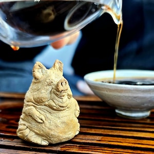 One of a kind ceramic artwork of a well-fed pig tea pet as a symbol of prosperity on your tea tray or workspace as decorative sculpture.
