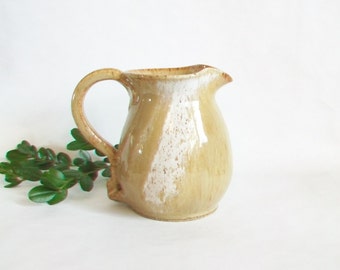 Pitcher - Wheel Thrown in Speckled Stoneware with a Cream and Caramel Glaze