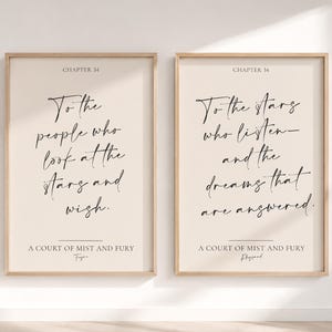 May include: Two vertical wall art prints in light wood frames featuring black calligraphy on a cream background. The left print reads Chapter 34, To the people who look at the stars and wish, A Court of Mist and Fury, Feyre. The right print reads Chapter 34, To the stars who listen—and the dreams that are answered, A Court of Mist and Fury, Rhysand.