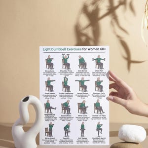 May include: A white ceramic sculpture with a curved design and a poster titled "Light Dumbbell Exercises for Women 60+". The poster displays various exercises with illustrations. A hand is visible near the poster.