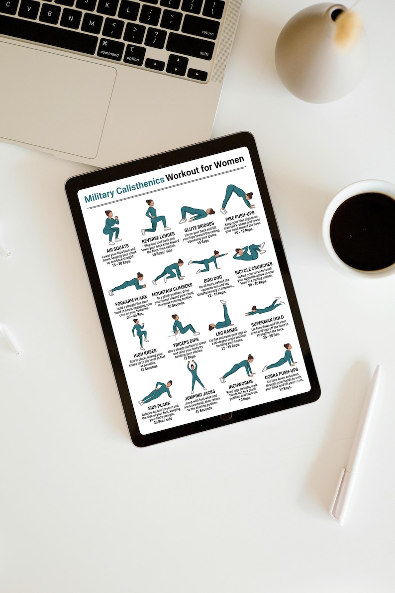 May include: A black tablet displays a workout routine titled "Military Calisthenics Workout for Women." The routine includes exercises like air squats, reverse lunges, and pike push-ups. A laptop, a cup of coffee, and a pen are also visible.