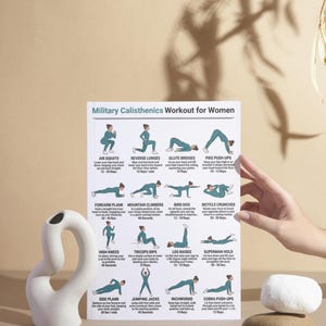 May include: A white ceramic sculpture with a curved design and a workout chart titled "Military Calisthenics Workout for Women." The chart displays various exercises with illustrations and instructions. A hand is holding the chart.