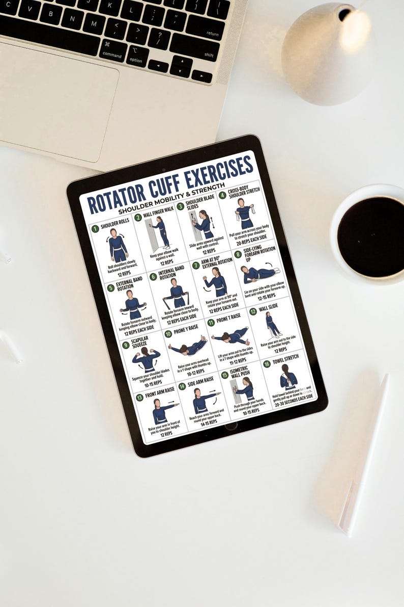 May include: A tablet displaying "Rotator Cuff Exercises" with diagrams and instructions for shoulder mobility and strength. The tablet is on a white surface with a laptop, a coffee cup, and a decorative object.