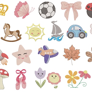 Pode incluir: Uma coleção de patches bordados com vários desenhos. Inclui uma coroa dourada, borboleta rosa, bola de futebol, laço, joaninha, pião, cavalo de baloiço, sol, barco à vela, carro, foguete, estrela, avião, folhas, cogumelo, sapatilhas de ballet, flores e uma borboleta.