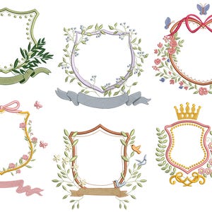 May include: Set of six embroidery designs featuring different floral and crown motifs surrounding a blank shield shape. The designs are perfect for adding a touch of elegance to any project.
