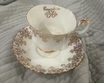 This vintage piece is a Royal Albert fine bone china teacup and saucer set from their Special Occasions series.