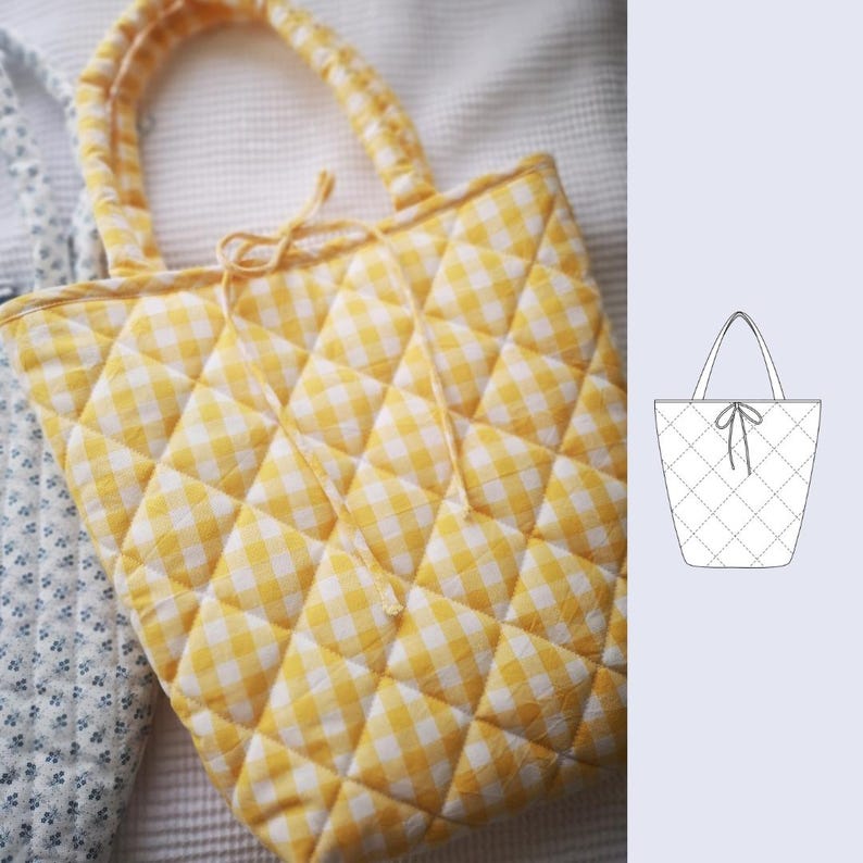 May include: A yellow and white gingham quilted tote bag with matching handles and a tie closure. The bag has a diamond pattern and is made of a soft fabric. The bag is designed for carrying items.