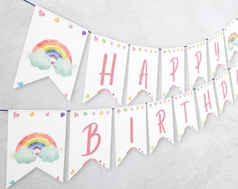 May include: White banner with pink letters spelling "Happy Birthday" and rainbow illustrations on each flag.