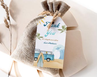May include: A white thank you tag with blue and yellow watercolor illustrations of a beach scene, a van, and a surfboard. The text on the tag reads "Thank You for riding the waves with me Love [Name]"