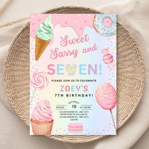 May include: A pink and blue birthday invitation with a sweet and sassy theme. The invitation features a variety of colorful treats, including ice cream, donuts, candy, and cupcakes. The text on the invitation reads "Sweet Sassy and Seven!" and includes the name "Zoey's" and the date "August 18".