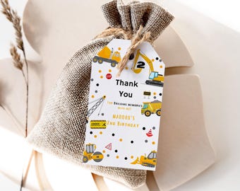 May include: A white thank you tag with a yellow, black, and gray construction theme. The tag says "Thank You for building memories with me! Maddox's 2nd Birthday".