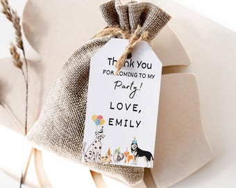 May include: A white thank you tag with black text that reads "Thank you for coming to my party! Love, Emily". The tag is attached to a small burlap bag with a brown twine string. The tag also features a colorful illustration of dogs and cats wearing party hats.