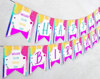 May include: A colorful banner with the words "Welcome to my special day" and "Happy Birthday" in pink letters. The banner is decorated with paint splatters and colorful pencils.