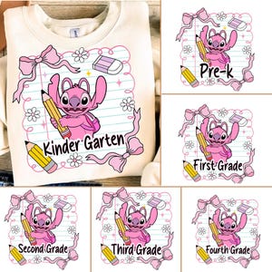 May include: Cream-colored sweatshirt featuring a pink cartoon character holding a pencil, with the words "Kinder Garten" in a pink frame with bows and flowers. Additional designs show the character with grade level labels.