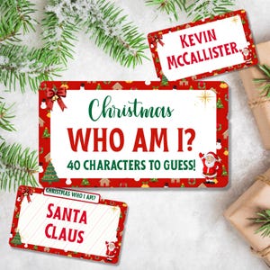 May include: Christmas-themed game cards with red borders and festive illustrations. The cards feature text that reads "Christmas WHO AM I?" and "40 CHARACTERS TO GUESS!" Additional cards say "KEVIN MCCALLISTER" and "SANTA CLAUS."
