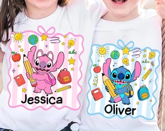 May include: Two white t-shirts with cartoon character designs. One shirt features a pink character holding a pencil, with the name "Jessica" below. The other shirt has a blue character with a pencil and the name "Oliver". Both shirts have school-themed graphics.
