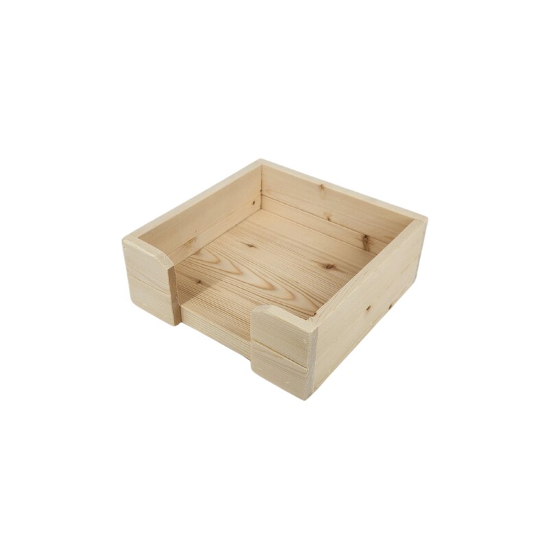 May include: A natural wood square tissue box holder with a simple design. The holder is made of unfinished wood and has a rectangular opening for tissues.
