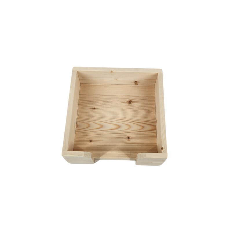 May include: A wooden box with a square shape and an open top. The box is made of light-colored wood and has a smooth finish.