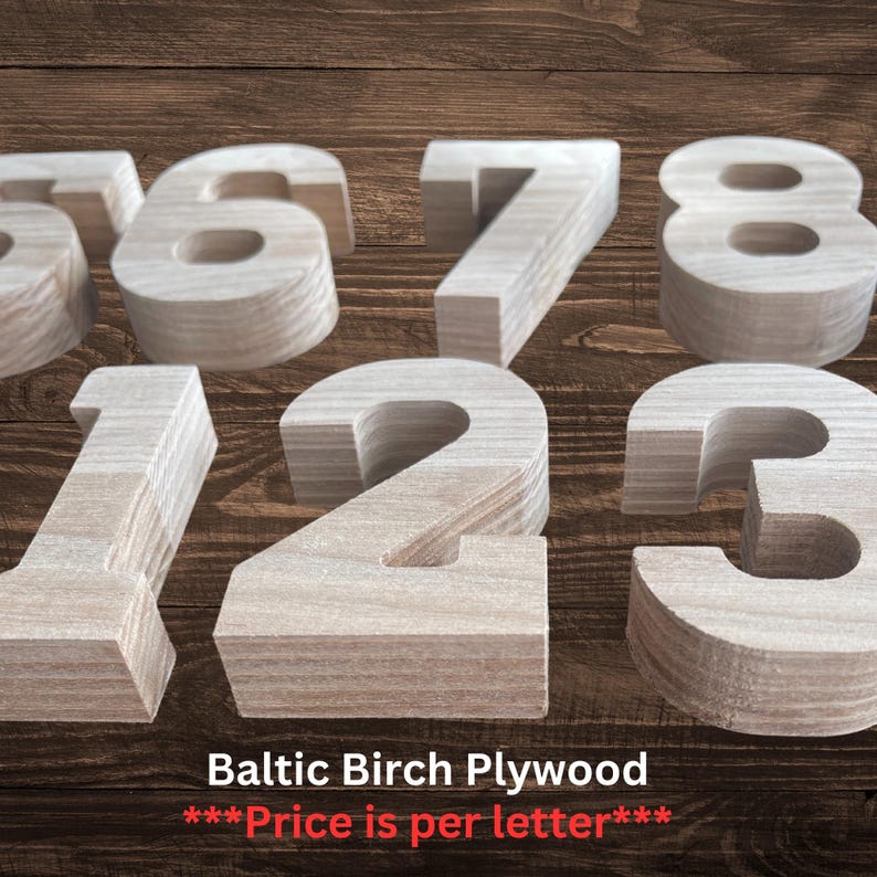May include: A collection of freestanding numbers crafted from light-colored Baltic Birch plywood. The set includes the digits one, two, three, six, seven, and eight, each featuring a thick, block-style design with visible wood grain texture.
