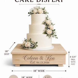 May include: A square wooden cake stand with the engraved text "Coleen & Ken Est. 06.13.2026" on the front. The stand measures 18 inches wide, 18 inches deep, and 4-3/4 inches tall with feet. A three-tier white cake decorated with roses sits on top.