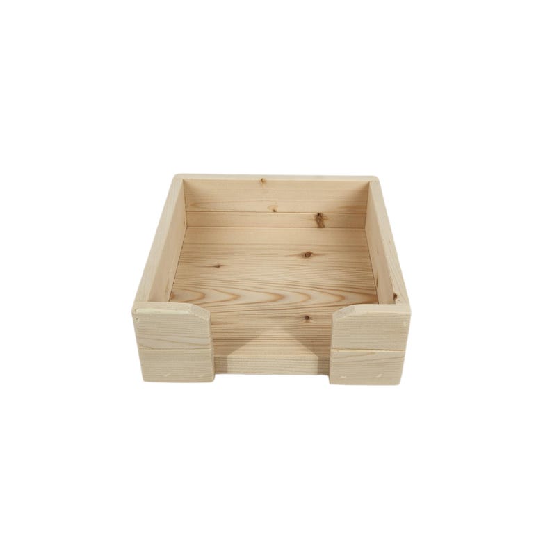 May include: A wooden box with a rectangular shape and a small opening in the front. The box is made of natural wood and has a light brown color.