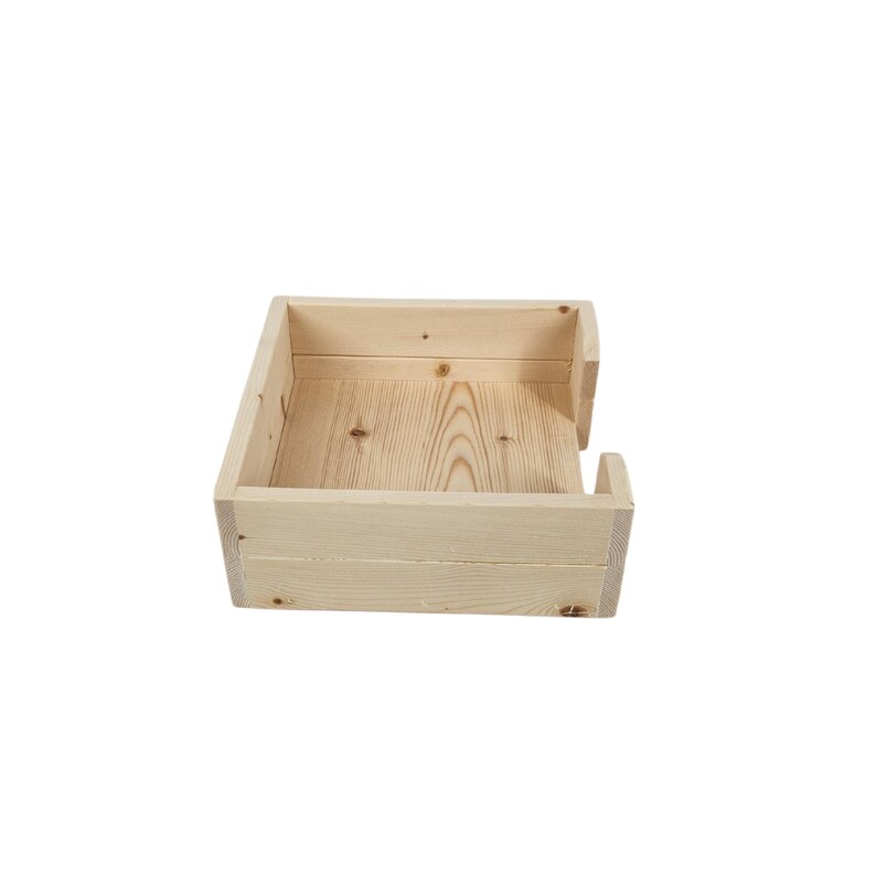 May include: A natural wood square tissue box holder with a simple design. The holder has a slot on the side for easy access to tissues.
