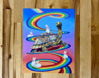 May include: A rectangular art print featuring a large tortoise with a patterned shell and a long neck, surrounded by five small white rabbits. A vibrant, multi-colored rainbow swirls in a spiral pattern across a bright blue and pink gradient background.