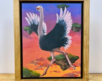 May include: A framed painting of a large bird with dark gray and white wings, standing on a floating green island against a vibrant sunset sky with purple and orange hues. The bird has a long neck and is depicted in a dynamic, mid-stride pose.