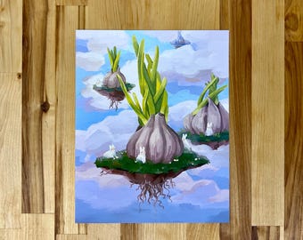 May include: A rectangular art print featuring a surreal painting of three floating islands in a blue sky with white clouds. Each island supports a large purple garlic bulb with green shoots and small white rabbits sitting on the grassy surface.