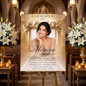 May include: A memorial sign with a photo of a woman, framed in gold, with the text "A Celebration of Life." The sign includes the name "Monica" and dates "April 5, 1956 - June 7, 2026." It is displayed on a gold easel in a church.