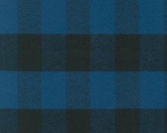 May include: A blue and black plaid fabric with a soft, fuzzy texture.