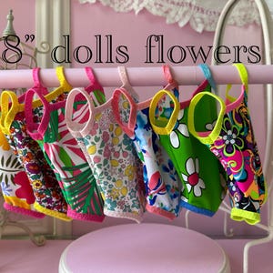 American made Swimsuit and a bow!  This outfit is handmade and designed to fit popular 18"  dolls
