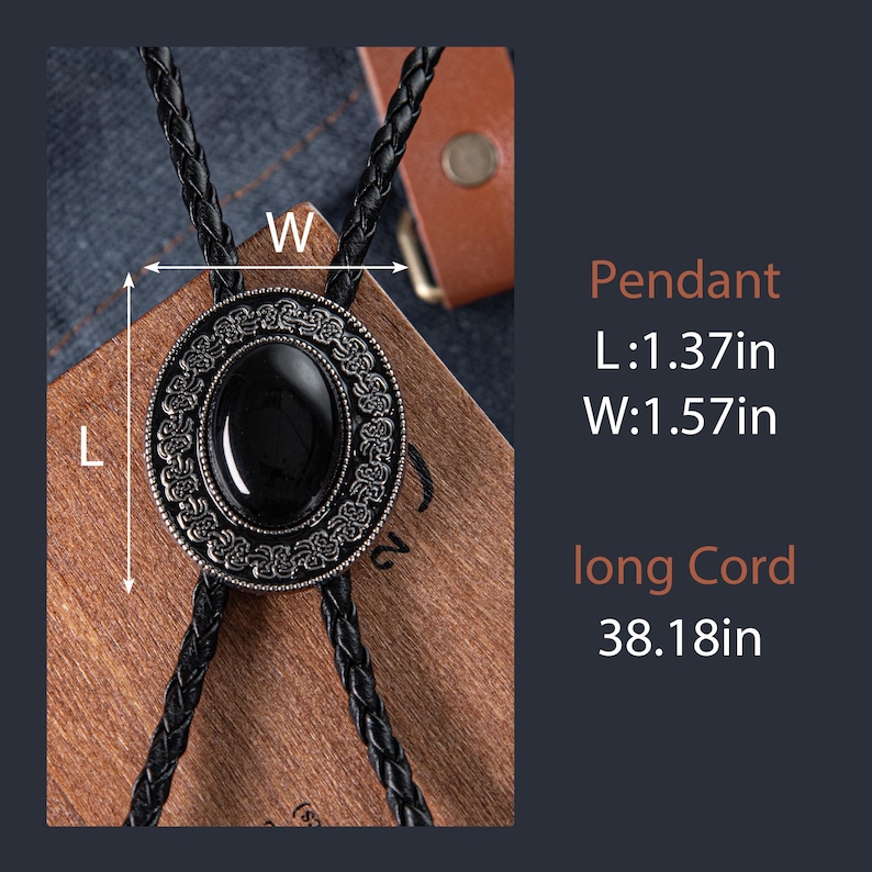 May include: A black bolo tie with a silver-toned pendant featuring a black oval stone surrounded by an intricate design. The pendant measures 1.37 inches long and 1.57 inches wide. The cord is 38.18 inches long.