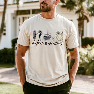 A man wearing a t-shirt with a graphic design featuring characters from the TV show Friends.