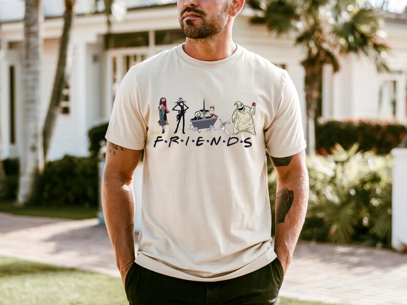 A man wearing a t-shirt with a graphic design featuring characters from the TV show Friends.