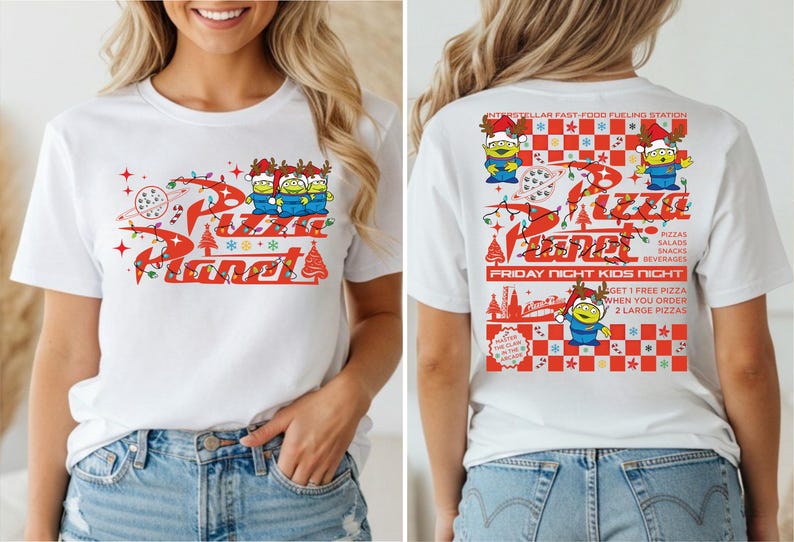 A woman wearing a white t-shirt with a red and white design featuring a cartoon character and text related to a pizza-themed event.
