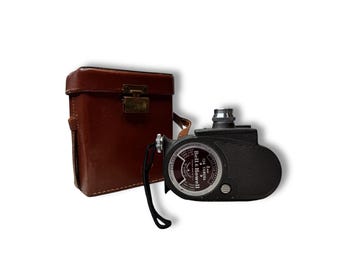 Cámara de cine Bell & Howell 134 de 8 mm con estuche, cámara de película de cuerda de mediados de siglo
