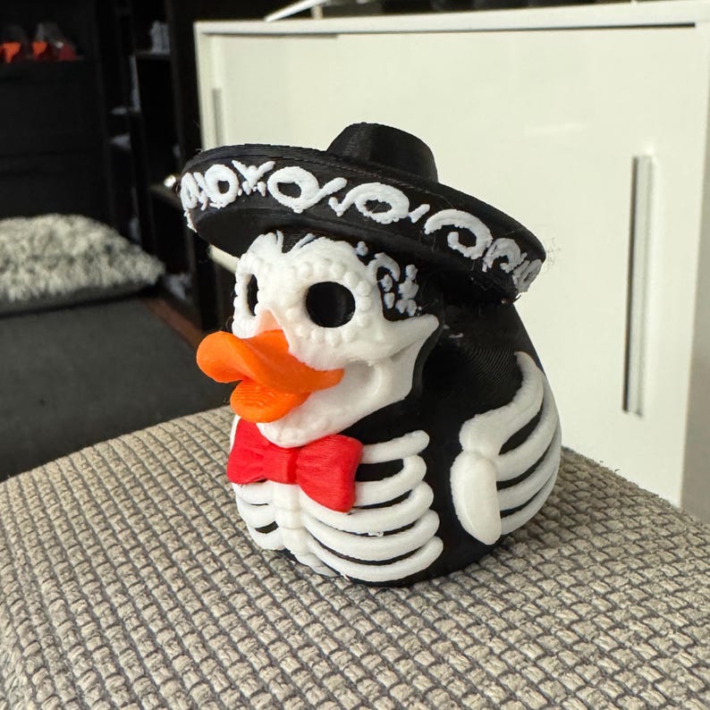 Jeep Ducking Gift Skeleton Mariachi Duck Halloween Dashboard Decoration Spooky Vehicle Accessory 3D Printed Collectible Figure Dia Muertos Celebration Sombrero Character Red Bow Tie Detail Black Design Orange Beak Festive Holiday Item