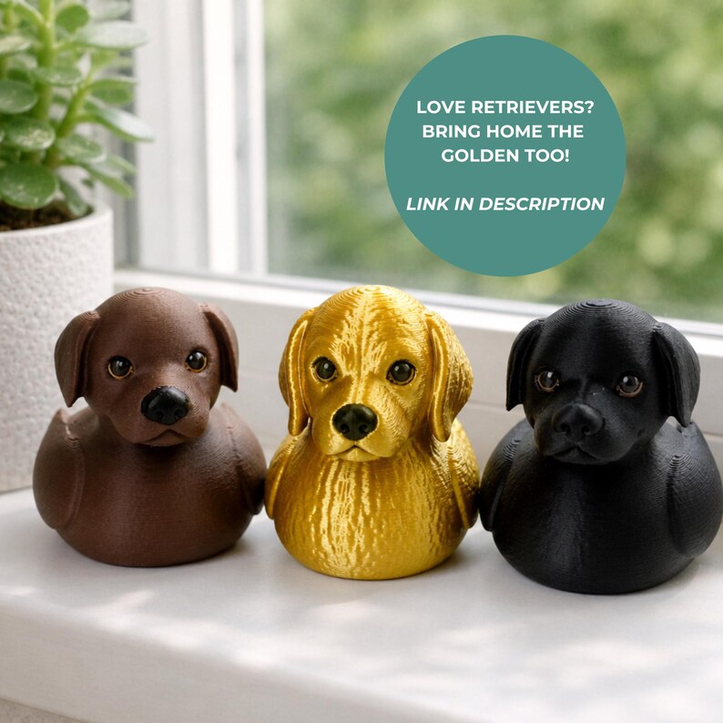May include: Three dog-shaped figurines in a row. The dogs are brown, gold, and black. The gold dog has a textured surface. The text in the image says "LOVE RETRIEVERS? BRING HOME THE GOLDEN TOO! LINK IN DESCRIPTION."