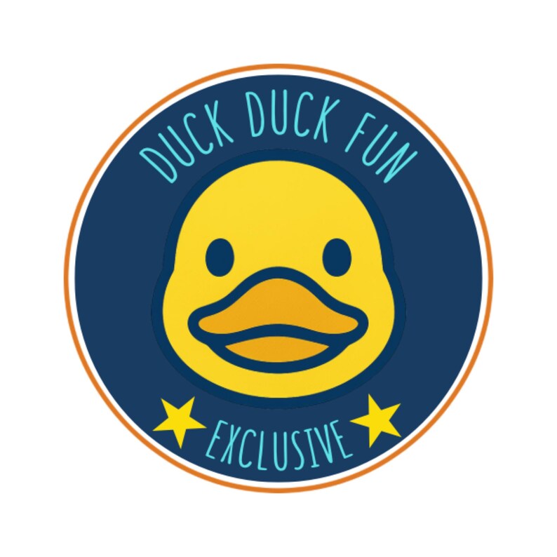 May include: A circular sticker with a yellow duck face in the center, surrounded by a navy blue ring with the words "DUCK DUCK FUN" in teal. Two yellow stars flank the word "EXCLUSIVE" in teal.