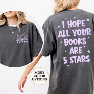 May include: Dark grey t-shirt with the text "I HOPE ALL YOUR BOOKS ARE 5 STARS" in lavender on the back. A smaller image of an open book and stars is on the front. The shirt is a comfortable, oversized fit.