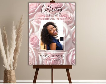 May include: A memorial poster with a pink floral background. The poster features a photo of a woman with the text "Celebrating the life of Maya Johnson 10.5.1952 - 1.1.2023"