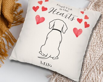 May include: Cream-colored square pillow with a black and white illustration of a dog facing away. Red hearts and the words "Forever in Our Hearts" are printed above the dog. The dog's name, "Milo," is printed below.