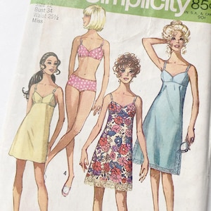 May include: Vintage Simplicity sewing pattern featuring illustrations of lingerie and sleepwear. The pattern includes a slip, a floral print chemise, a pink polka dot bra and panties set, and a yellow slip dress. The pattern size is 12, with a bust of 34 inches and a waist of 25.5 inches.