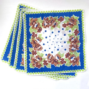 May include: Four square handkerchiefs with a blue border and a green dotted edge. The center features a white background with blue polka dots and a floral design in brown and green.