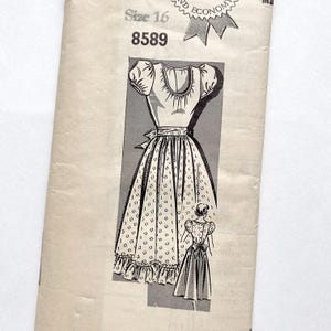 May include: Vintage dressmaking pattern with a detailed illustration of a dress design. The pattern is labeled "Size 16" and "8589". The dress features a fitted bodice, puffed sleeves, a full skirt with a dotted pattern, and a ruffled hemline. A smaller illustration of the dress is also shown.