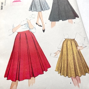 May include: Vintage skirt pattern illustration featuring four skirt designs. The skirts are in red, gray, silver, and gold. The illustration shows the skirts with a white blouse and gloves. The text "Skirt Set" is visible.